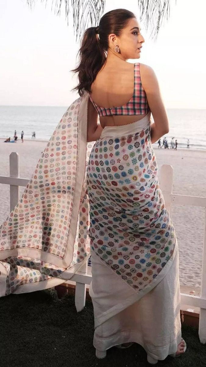 Back view showing the full drape of the saree over the shoulder